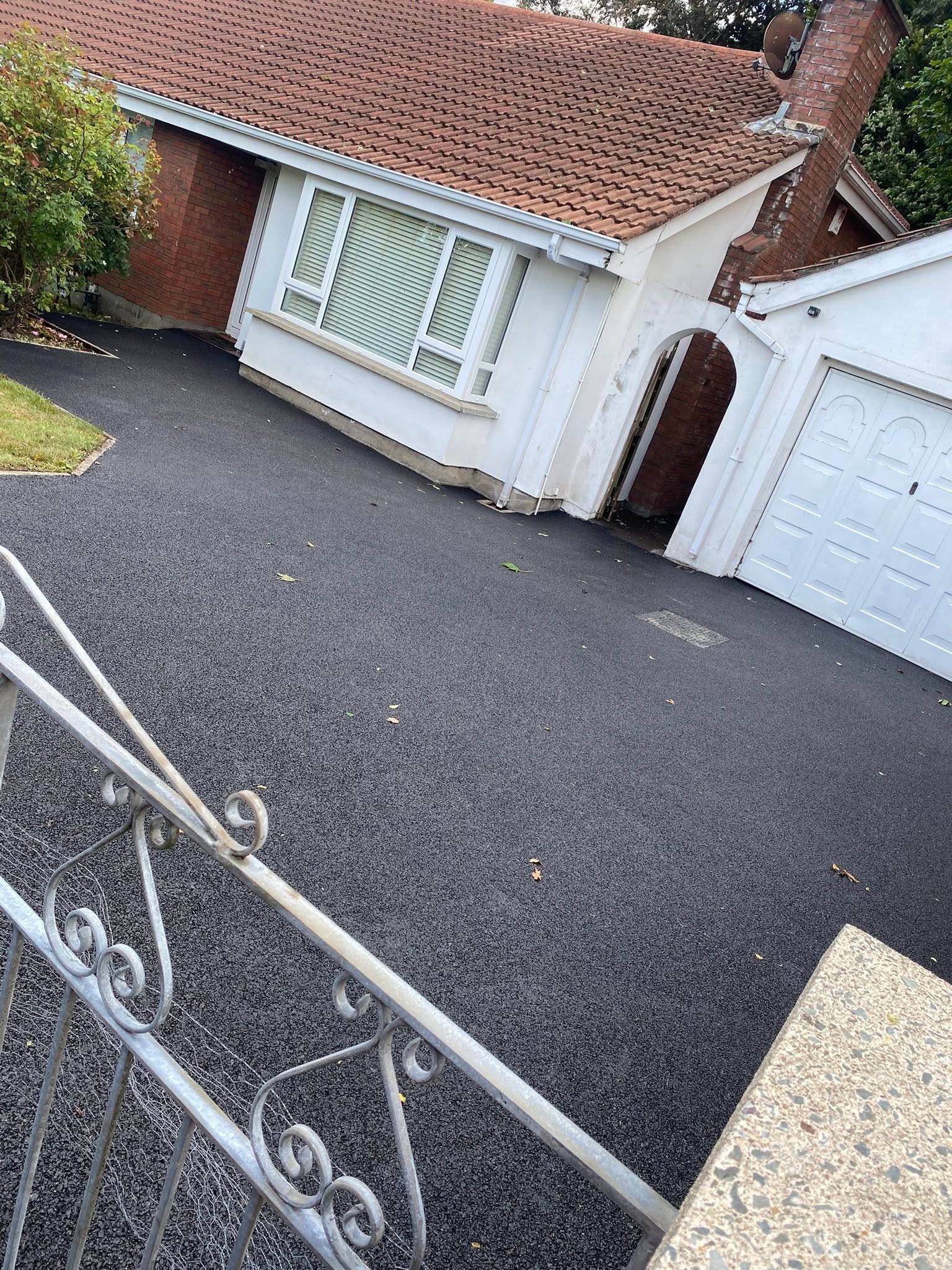 Fresh asphalt driveway following groundwork preparation