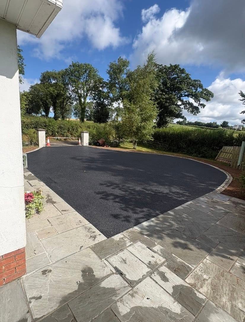 Newly surfaced tarmac driveway and front entrance